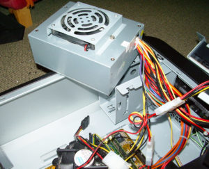 This is power supply unit (PSU). In one job we had we diagnosed a faulty PSU not supplying enough power after a little detective work and fitted a replacement ready for the customer to take home the next day.
