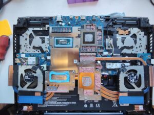 Fans and heatsinks unscrewed exposing liquid metal, thermal paste and putty (Sheffield Computer Services repair near me Heeley S2)