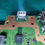 A HDMI socket with the pads connected, before adding solder to the main pads to hold the PS5 HDMI in place.
