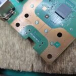 PS5 HDMI connector pads - with solder removed, before three trace repairs were completed because of the broken pads.