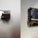 Side and top view of a damaged HDMI port from a PlayStation 5