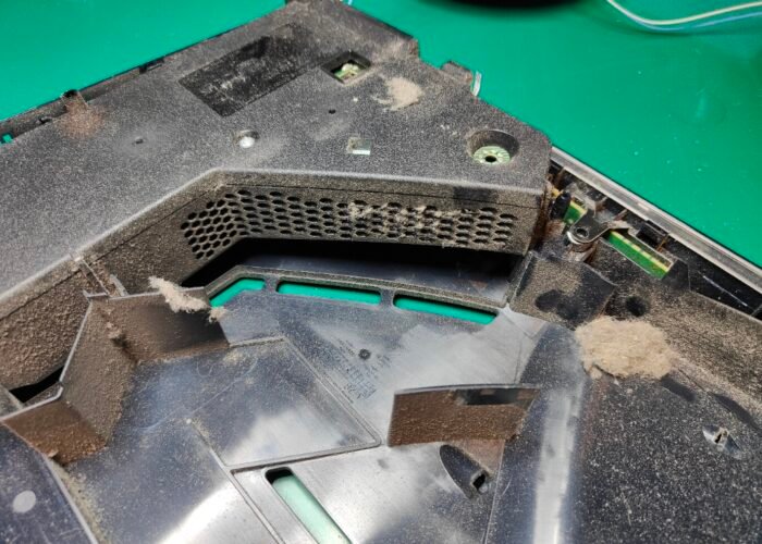 The power supply from a PlayStation 5. Dust often builds up inside, and the extra heat can cause components to fail. We use compressed air to blow the dust out.
