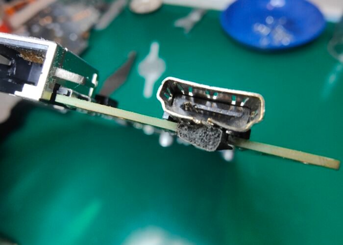 Damaged PS5 HDMI socket - this will be desoldered from the motherboard and replaced with a new port.