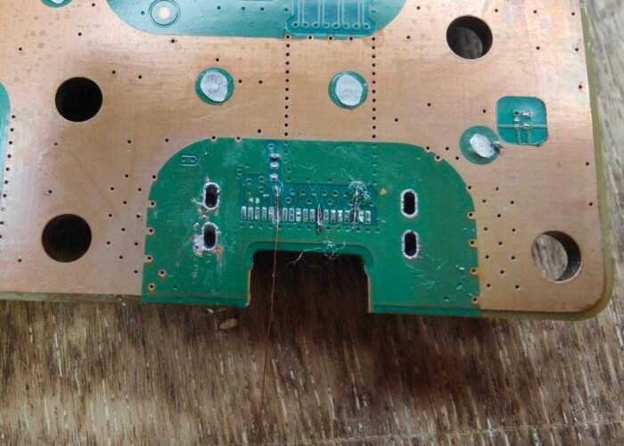 Part way through trace repairs on a PS5 HDMI socket's connector pads. This is a tricky repair requiring micro-soldering techniques.