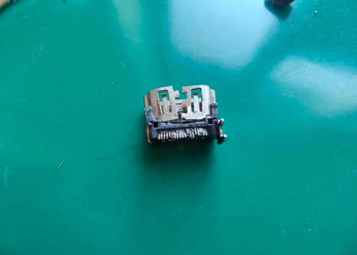 Here we can see the ripped of connector pads on the damaged PS5 motherboard where the HDMI socket was.
