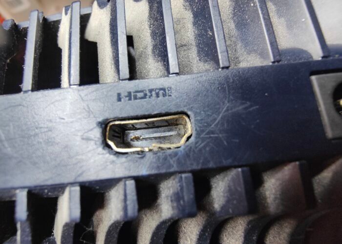 This is the damaged HDMI socket on a PS5 before any work has started. Looking at the port alone, we can’t tell if the damage stops at the socket or goes deeper, to lifted connector pads or broken traces that need repair. We only know for sure once the old port is removed and the board can be inspected.
