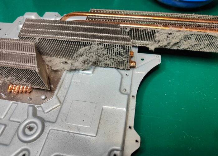 Dust on the large heatsinks of a PlayStation 5. It’s a lot, but not an uncommon amount. If it isn’t cleaned soon, it will lead to overheating and a louder fan that runs for longer.
