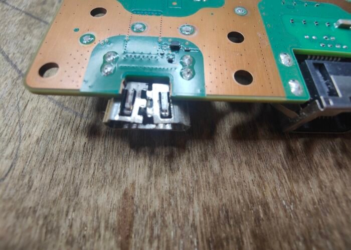 Damage to the HDMI port on this PS5 is clear to see - must have taken quite a knock to open up the metal case like that.