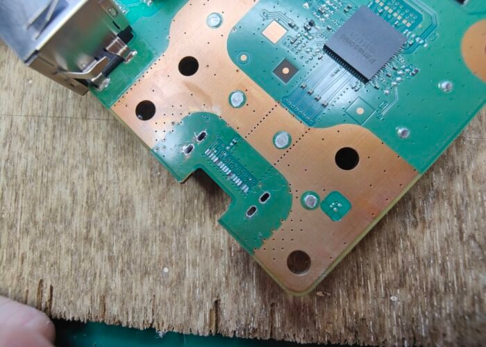 Here you can see the connector pads that were ripped away from the PS5 motherboard when the HDMI socket was forced out of place. These pads need rebuilding before a new port can be fitted.